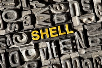 Old lead letters forming the word "SHELL"