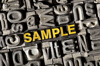 Old lead letters forming the word 'SAMPLE'