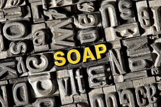 Old lead letters forming the word "SOAP"