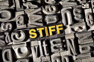 Old lead letters forming the word 'STIFF'