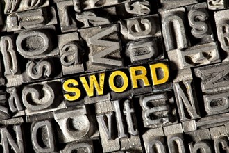 Old lead letters forming the word "SWORD"