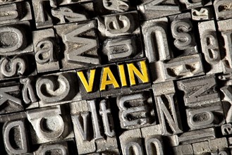 Old lead letters forming the word Vain