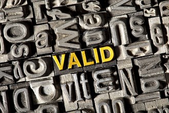 Old lead letters forming the word Valid