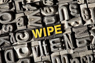 Old lead letters forming the word 'wipe'
