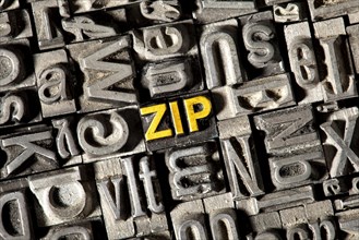 Old lead letters forming the word 'zip'