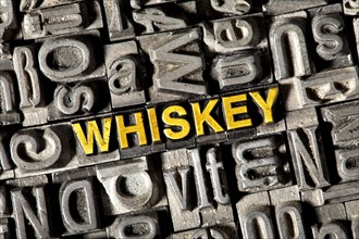 Old lead letters forming the word Whiskey