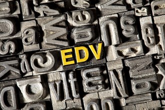Old lead letters forming the abbreviation EDV