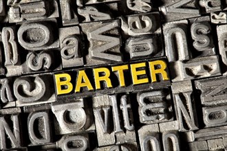 Old lead letters forming the word "BARTER"