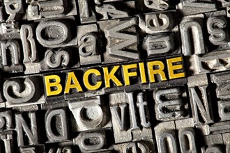 Old lead letters forming the word 'BACKFIRE'