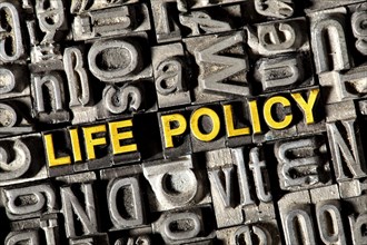 Old lead letters forming the words Life Policy