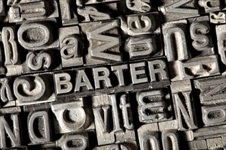 Old lead letters forming the word 'BARTER'