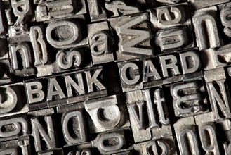 Old lead letters forming the words "BANK CARD"
