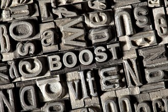 Old lead letters forming the word 'BOOST'