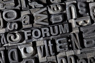 Old lead letters forming the word FORUM