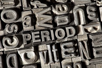 Old lead letters forming the word "PERIOD"