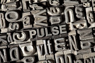 Old lead letters forming the word 'PULSE'