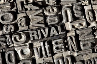 Old lead letters forming the word RIVAL