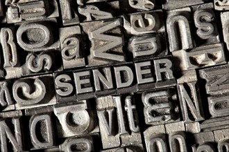 Old lead letters forming the word SENDER