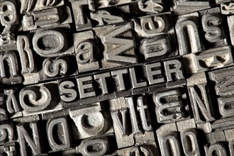 Old lead letters forming the word SETTLER
