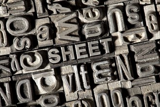 Old lead letters forming the word SHEET