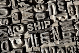 Old lead letters forming the word SHIP
