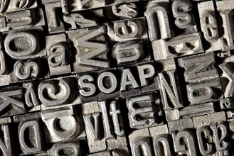 Old lead letters forming the word 'SOAP'