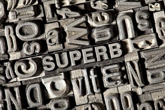 Old lead letters forming the word 'SUPERB'