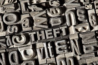 Old lead letters forming the word THEFT