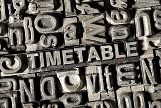 Old lead letters forming the word TIMETABLE