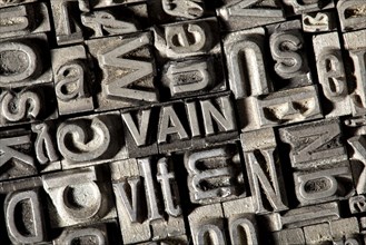 Old lead letters forming the word VAIN