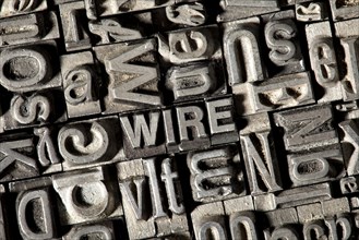 Old lead letters forming the word WIRE