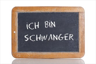 Old school blackboard with the words ICH BIN SCHWANGER