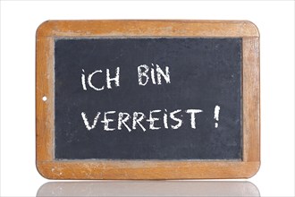 Old school blackboard with the words ICH BIN VERREIST!