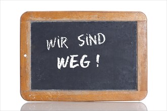 Old school blackboard with the words WIR SIND WEG!