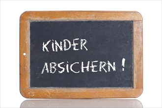 Old school blackboard with the words KINDER ABSICHERN!
