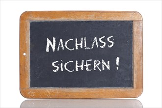 Old school blackboard with the words NACHLASS SICHERN!