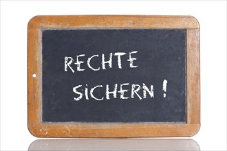 Old school blackboard with the words RECHTE SICHERN!