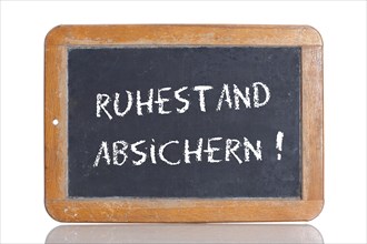 Old school blackboard with the words RUHESTAND ABSICHERN!