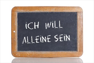 Old school blackboard with the words ICH WILL ALLEINE SEIN