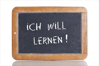 Old school blackboard with the words ICH WILL LERNEN!