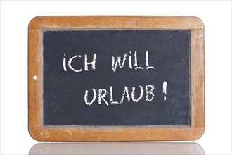 Old school blackboard with the words ICH WILL URLAUB!