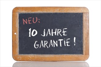 Old school blackboard with the words NEU: 10 JAHRE GARANTIE!