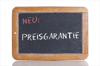 Old school blackboard with the words NEU: PREISGARANTIE