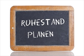 Old school blackboard with the words RUHESTAND PLANEN