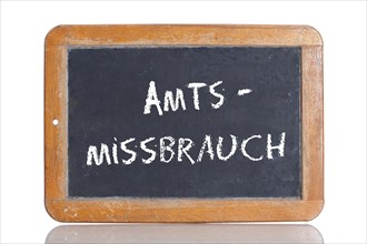 Old school blackboard with the word AMTSMISSBRAUCH