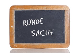 Old school blackboard with the term RUNDE SACHE