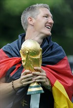 Bastian Schweinsteiger with the trophy
