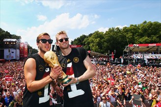 Mario Gotze and Andre Schurrle with the trophy