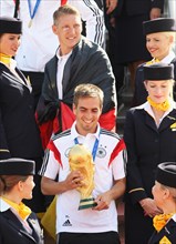 Philipp Lahm with the trophy and Bastian Schweinsteiger