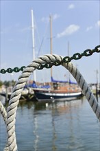 Ship's rope hanging over a chain